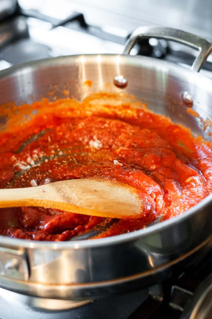 adding in the tomato paste